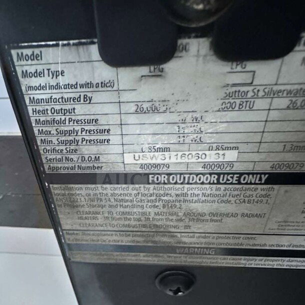 Label on Bromic Tungsten Smart-Heat gas heater showing model type, heat output, and pressure specs for outdoor use.