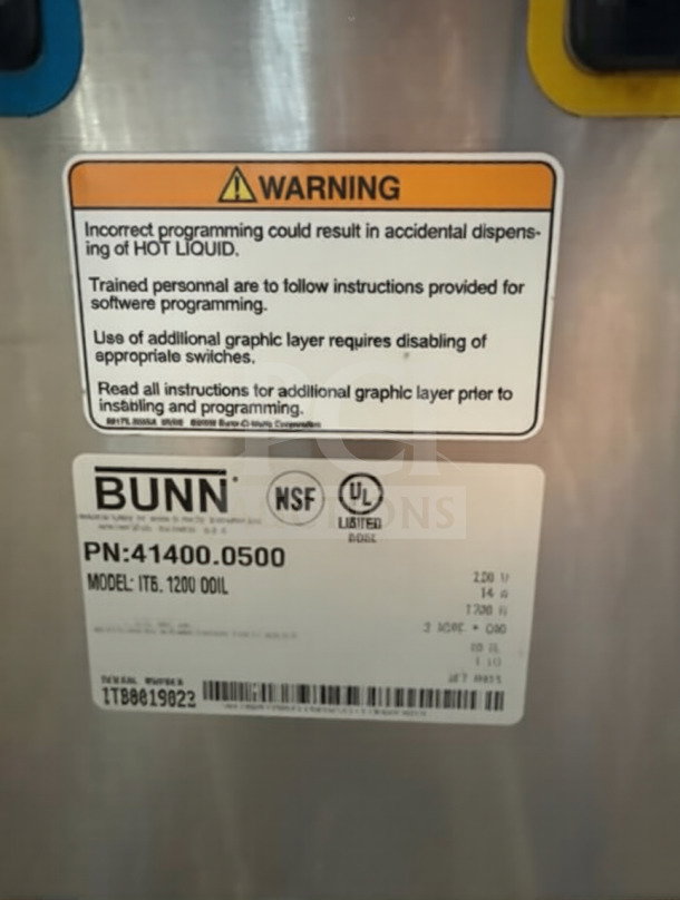 Label on Bunn 52000.0301 ITB tea brewer, NSF/UL listed, model ITB 120V DDIL, warning for hot liquid handling, like-new condition.