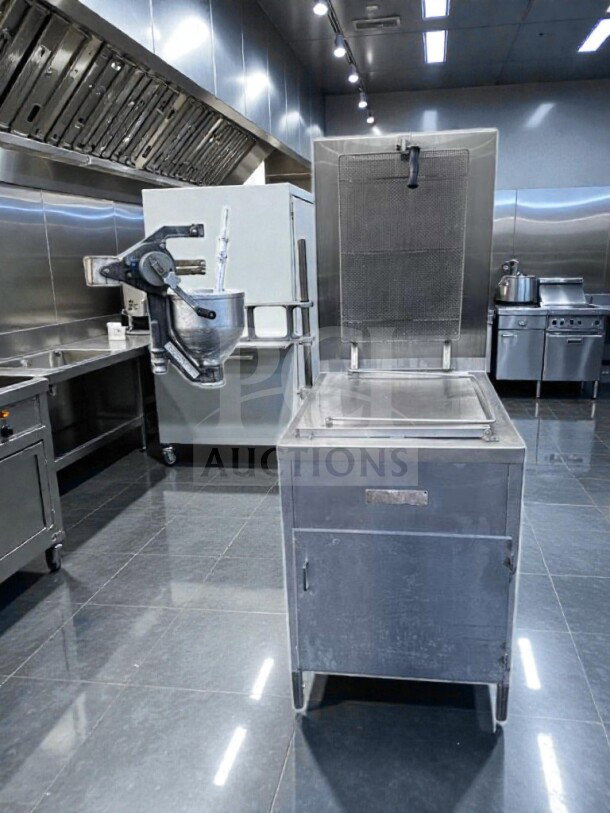 Stainless steel Lucks G1826 natural gas donut fryer, excellent condition, 60,000 BTU, open kettle, with donut screen and manual depositor.
