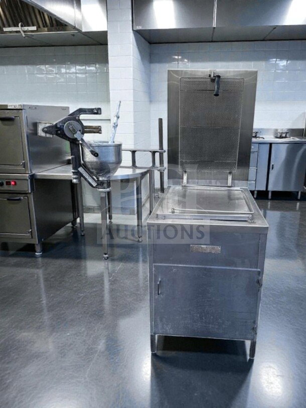 Lucks G1826 commercial donut fryer, stainless steel, 60,000 BTU, with screen and manual depositor, excellent condition.