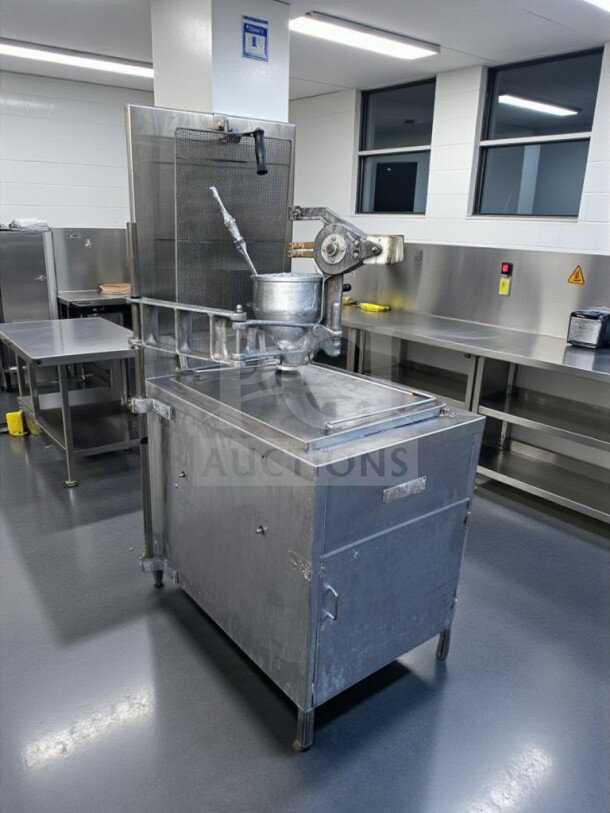 Stainless steel Lucks G1826 commercial donut fryer, 60,000 BTU, with open kettle, donut screen, and manual depositor. Excellent condition.