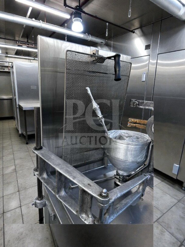 Lucks G1826 commercial donut fryer in excellent condition, stainless steel, 60,000 BTU, with screen and manual depositor.