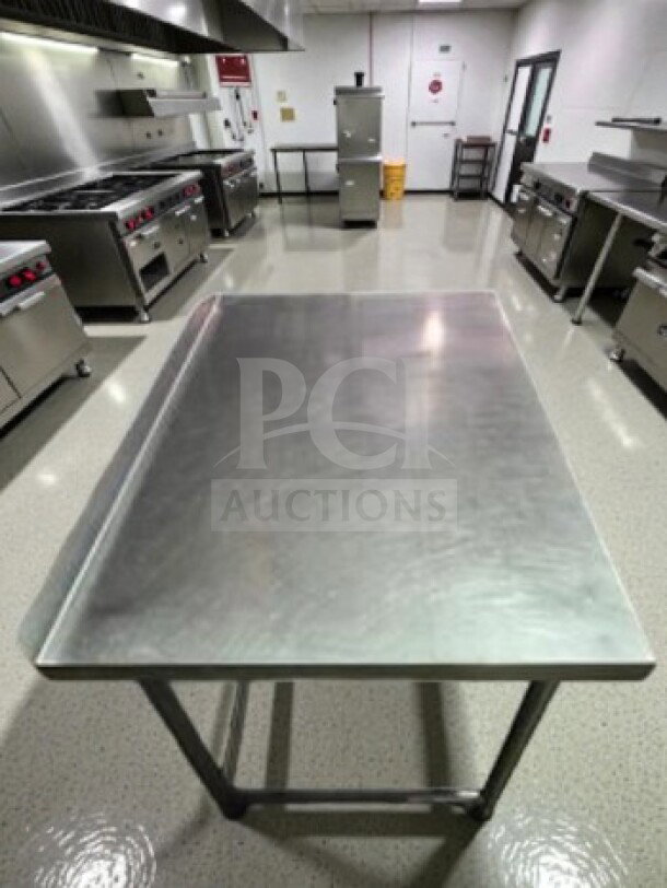 Stainless steel 46" x 30" mobile work table with wheels, unbranded, well-maintained, fully inspected, ready for use.