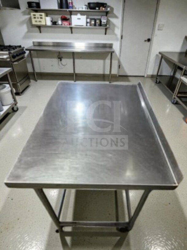 Unbranded stainless steel 46" x 30" mobile work table with wheels, well-maintained, inspected, and ready for use.