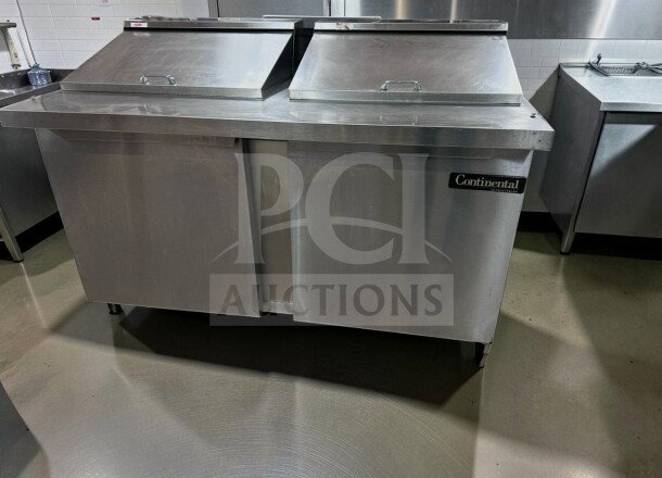 Stainless steel kitchen equipment with Continental Refrigeration logo, shown in commercial setting. Silver metallic finish.