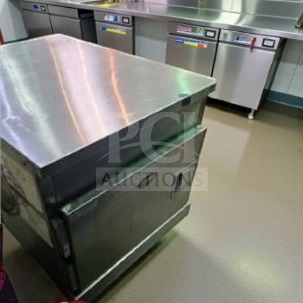 Alt text: FWE HLC-1826-4(A) countertop insulated heated holding cabinet, 4 pan capacity, stainless steel, excellent condition, 120V.
