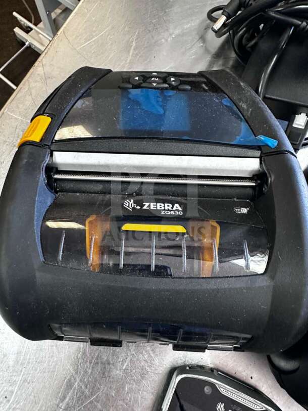 Zebra ZQ630 mobile thermal label printer, elite condition, fully tested, visible model marking, with power cables.