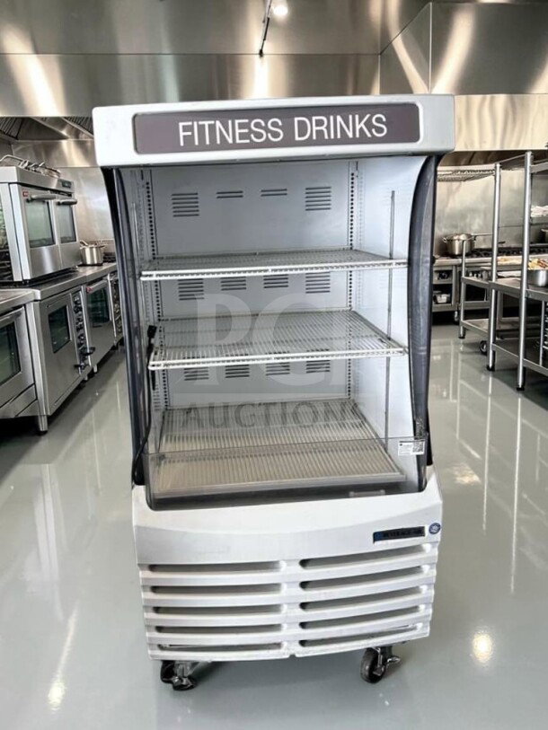 Beverage-Air BZ13-1-W open display case, 3-tier, 30” wide, refrigerated, labeled "Fitness Drinks," in excellent condition.