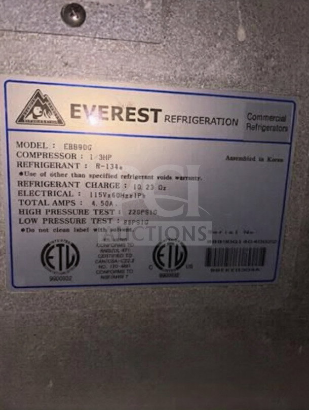 Everest EBB90G label showing model, electrical specs, and ETL/NSF certifications on a commercial refrigerator.
