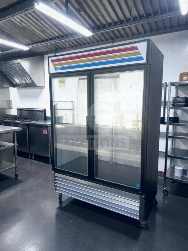 True GDM-49F-LTF-HC~TSL01 black glass door freezer with LED lighting, 8 shelves, 54" wide, NSF/UL listed, excellent condition.