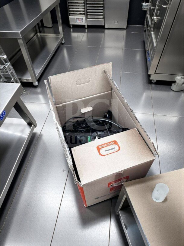 Box of POS system equipment in brand new condition, labeled "Move Easy," includes various hardware and accessories for restaurant use.