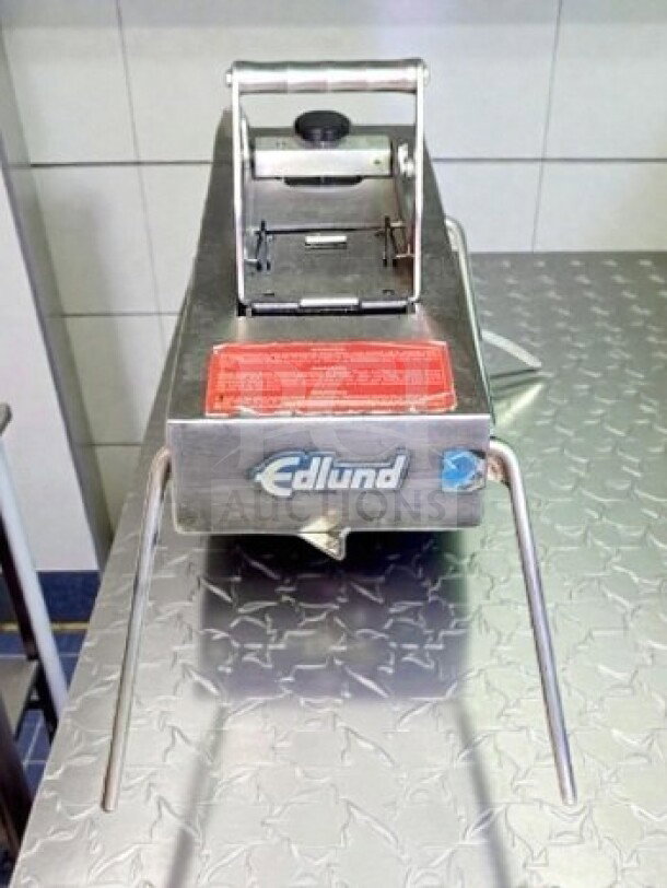 Edlund Series 350 electric tomato slicer, stainless steel and aluminum, NSF listed, fully tested, excellent condition.