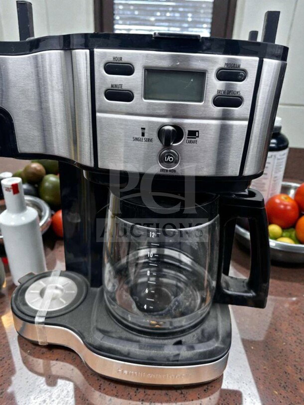 Brand new programmable 12-cup drip coffee machine, stainless steel and black, glass carafe, single serve/carafe options.