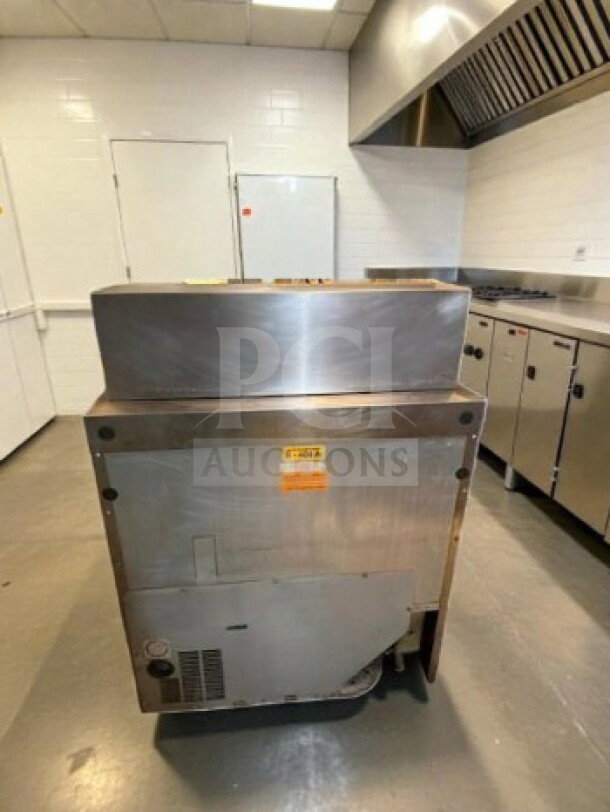 Delfield 4432NP-12M Mega Top refrigerated prep table, stainless steel, 32", 12 pan capacity, used but in top-tier condition.