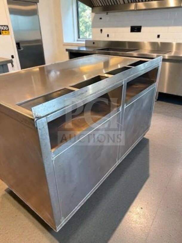Stainless steel work table with under cabinet storage, 57"x31"x38", exceptional condition, mobile, inspected and ready for use.