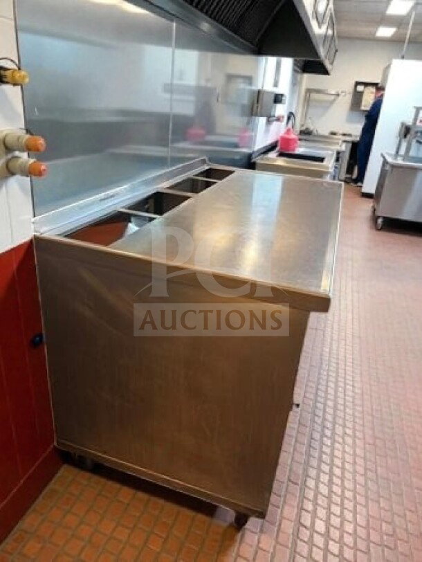 Stainless steel work table with under cabinet storage, 57"x31"x38", mobile, in exceptional condition, inspected and ready for use.