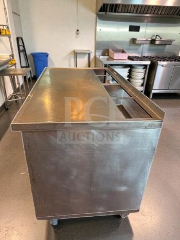 Stainless steel work table with under cabinet storage, 57"x31"x38". Mobile with casters, inspected, for commercial use.