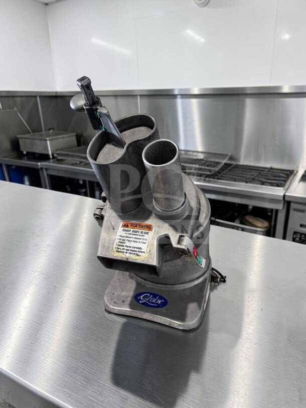 Globe GFP500 commercial food processor in remarkable condition. Features 1/2 HP motor, 115V, ETL/NSF certified, fully tested.
