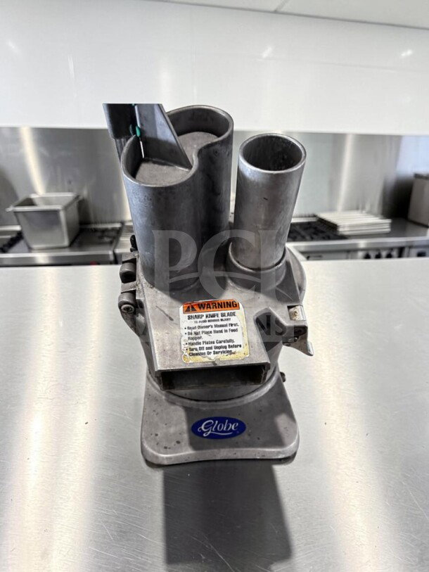 Globe GFP500 commercial food processor, excellent condition, 1/2 HP, 115V, ETL/NSF certified, warning label visible.