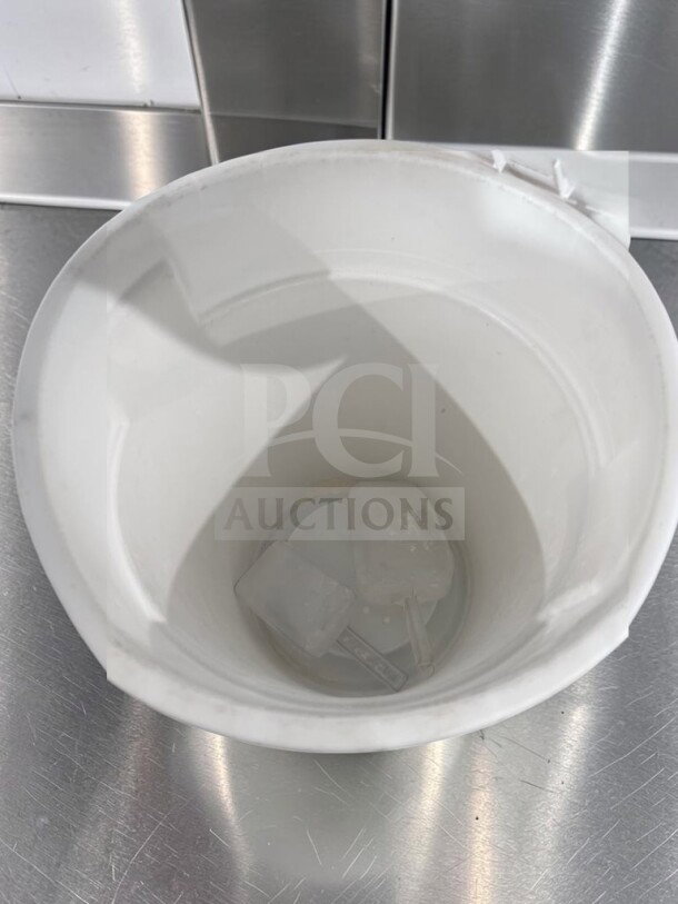 Like-new 32-gallon round commercial trash can, white, with lid and dolly. Heavy-duty, NSF/USDA style, for foodservice use.