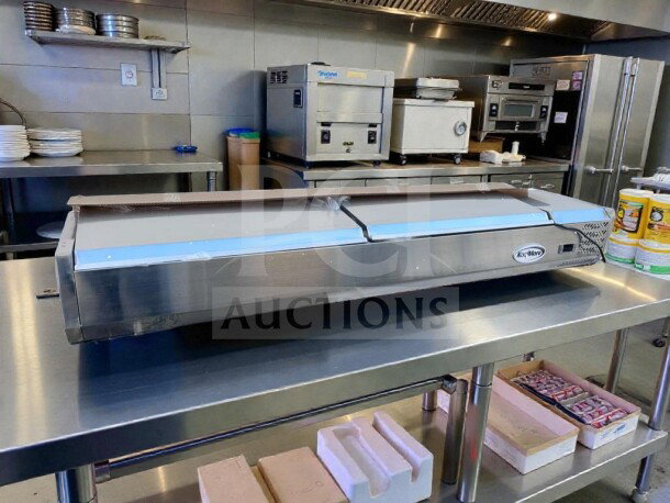 Brand new KoolMore SCDC-8P-SSL refrigerated prep rail in stainless steel, UL listed, open box, unused, on kitchen counter.