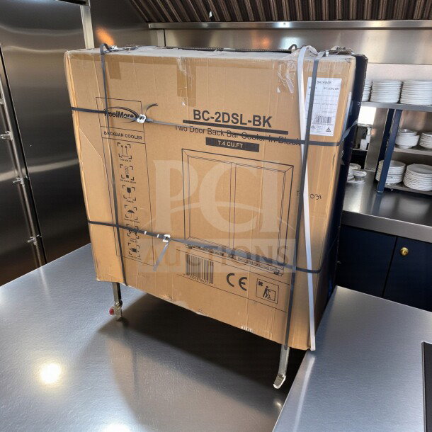 Brand new KoolMore BC-2DSL-BK two-door back bar refrigerator in box. Model: KOOL-L-BBR-0267. Capacity: 7.4 Cu. Ft.