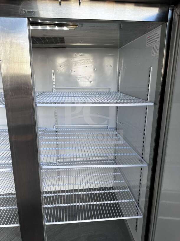 Genkraft S1200N 2-door stainless steel commercial freezer, pristine condition, interior shelving, fully operational.