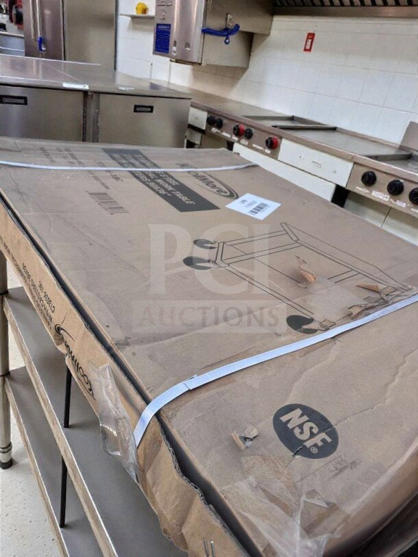 Brand new KoolMore CT3036-18C stainless steel work table in original box, NSF listed, dimensions 30"x36", with casters.