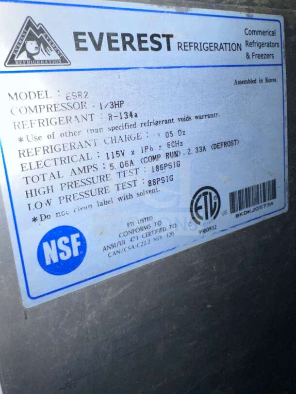 Everest ESR2 commercial reach-in refrigerator label showing model, specifications, NSF and ETL listings.