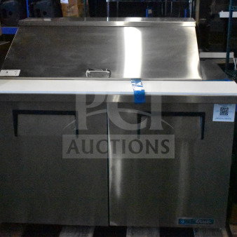 Brand new True TSSU-48-18M-B-HC sandwich salad prep table, bain marie mega top, 115V, with visible label and slight scratches.