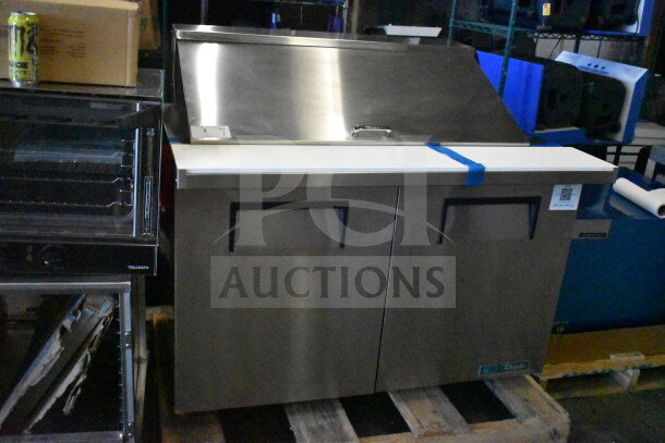 Brand new 2025 True TSSU-48-18M-B-HC commercial sandwich salad prep table in stainless steel, 115V, 1 phase. Scratch and dent condition.
