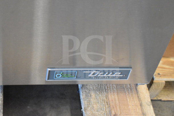 Brand new True TSSU-48-18M-B-HC commercial prep table, Mega Top, with markings indicating "natural refrigerant."
