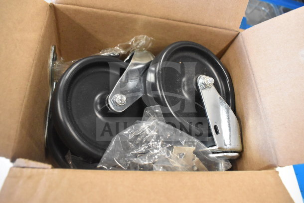 Box containing black caster wheels and metal fixtures for the True TSSU-48-18M-B-HC sandwich prep table.