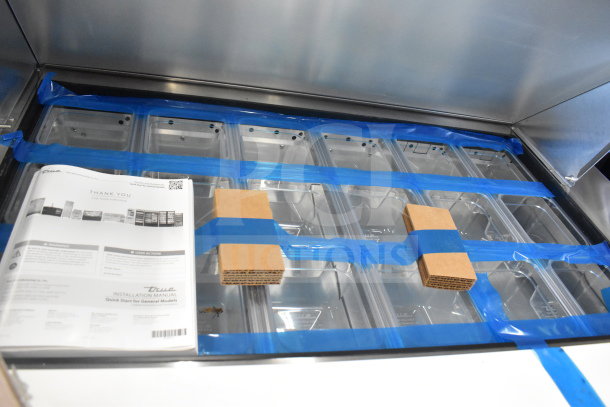 True TSSU-48-18M-B-HC sandwich salad prep table, wrapped in blue tape, new condition with manuals included.