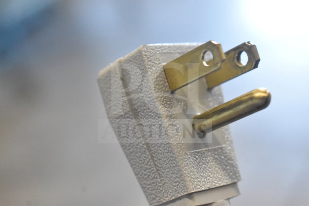 Close-up of a power plug from the True TSSU-48-18M-B-HC prep table.