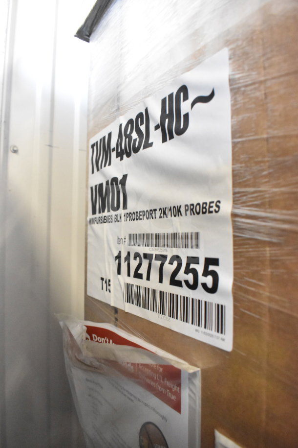 BRAND NEW 2025 True TVM-48SL-HC Commercial 2 Door Reach In Cooler Merchandiser. 115 Volts, 1 Phase. Scratch and dent condition. Labels show model and item number.