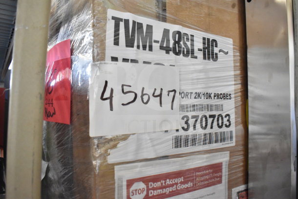 Brand new 2026 True TVM-48SL-HC cooler in packaging, minor scratches, labeled 115 volts, 1 phase, serial no. 370703.