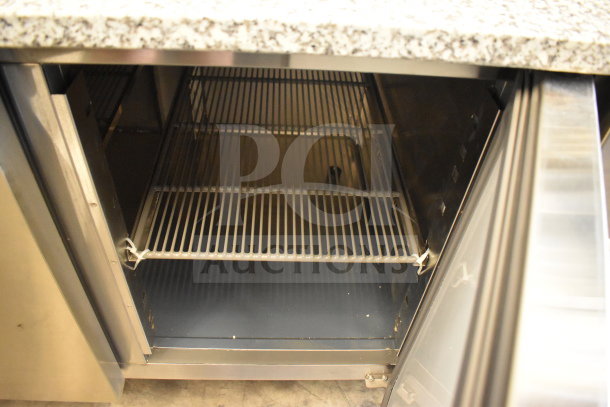 KoolMore KM-RPPS-2D59-GRT pizza prep station with granite top, stainless steel pan holder, and open refrigerated compartment.