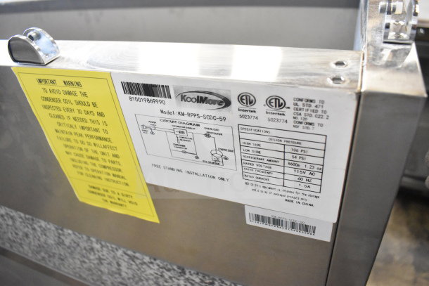 KoolMore KM-RPPS-2D59-GRT refrigerated granite top pizza prep station, stainless steel, 115V, commercial casters, model label visible.