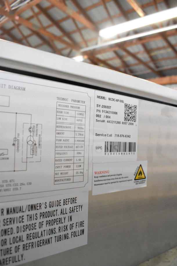 Brand new 2025 KoolMore SCDC-6P-SSL six pan refrigerated prep station label. Features and warnings detailed. Model SCDC-6P-SSL.