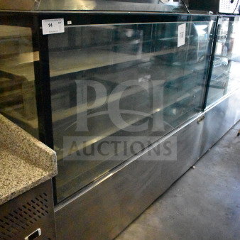 Brand new KoolMore commercial deli display case, glass-front, stainless steel body, tags indicate scratch and dent condition.