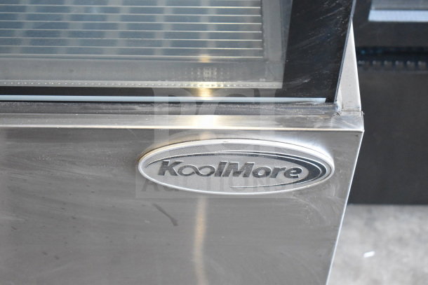 Brand new KoolMore commercial deli display case, scratch and dent condition. Features steel construction and KoolMore logo.