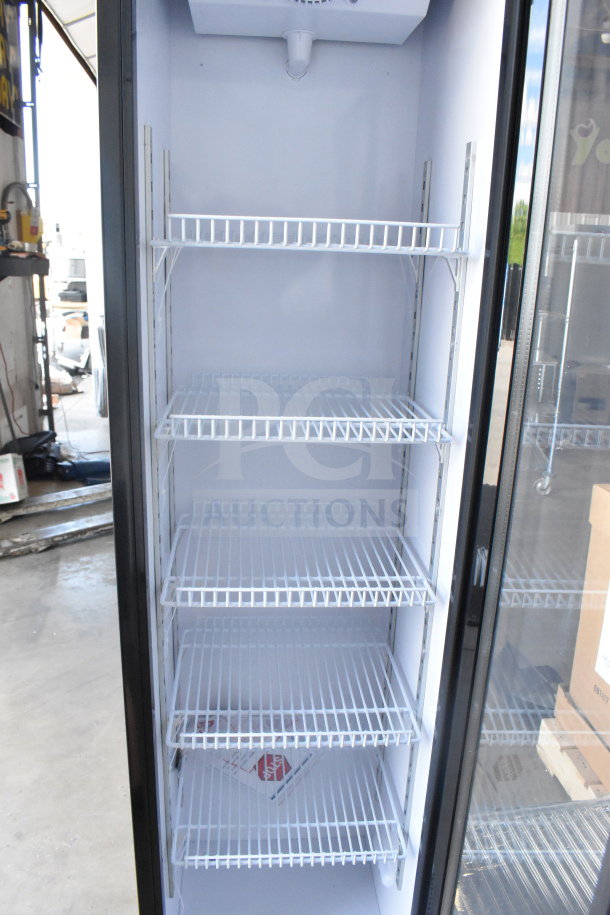 KoolMore KM-MDR-17S slim black merchandiser refrigerator, 17 in., 7 cu. ft., new with minor dents, interior shelves visible.