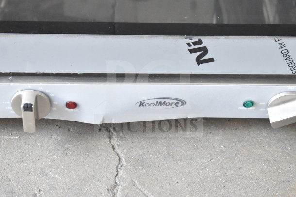 Brand new KoolMore KM-CTCO-15 convection oven with minor scratches and dents, 1600W power, four racks, 23 inches wide.