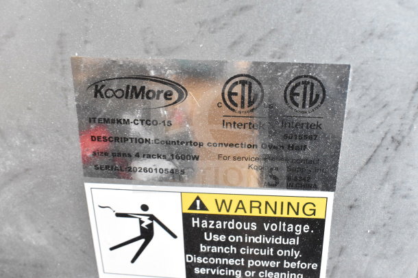 Label on 2026 KoolMore KM-CTCO-15 Convection Oven showing model, serial number, and warning about hazardous voltage.