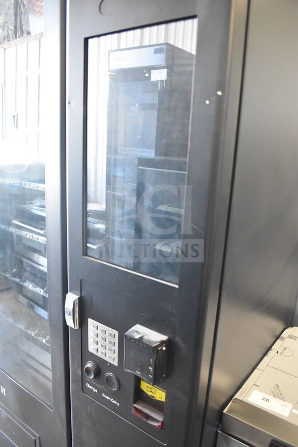 KoolMore commercial vending machine, brand new, showing scratch and dent. Features keypad, coin slot, and lock mechanism.