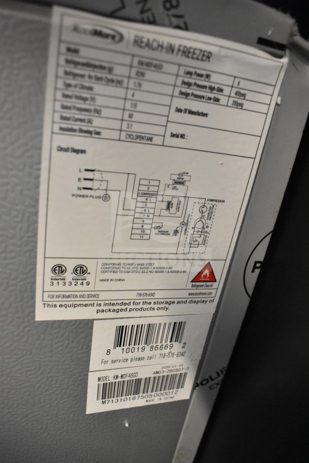 KoolMore KM-MDF46GD label showing model details for a 4.6 cu. ft. commercial display freezer. 115V, 1 Phase.