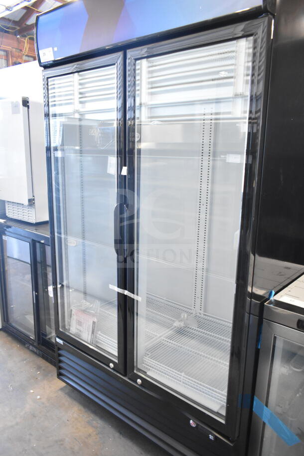 Brand new KoolMore MDR-2GD-35C glass door merchandiser refrigerator, 35 Cu. Ft., 115V, minor scratches.