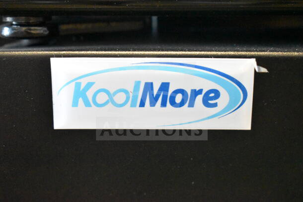 KoolMore logo on the front of MDR-2GD-35C glass door merchandiser refrigerator, new scratch and dent item.