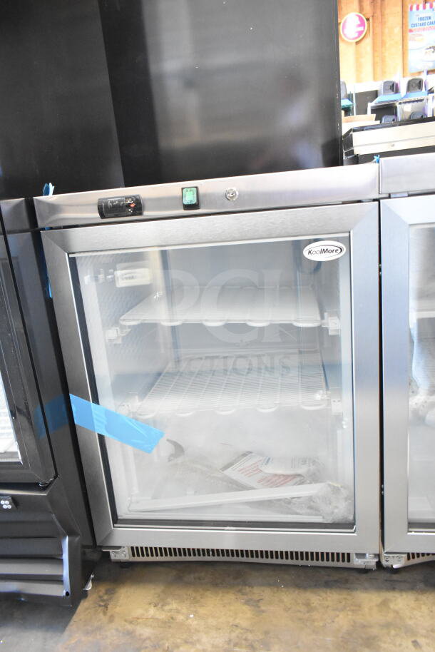 Brand new KoolMore KM-MDF46GD countertop display freezer, 24 in., 4.6 cu. ft., 115 volts, 1 phase, with visible scratch and dent.